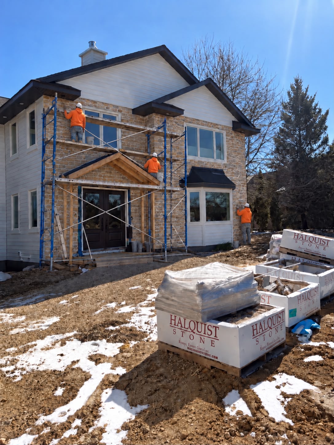 Madison Stone Company crew installing stone veneer